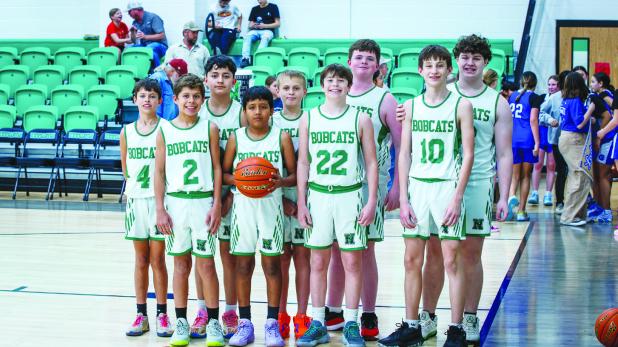 The NJH Bobcats pause for a photo before playing their championship game against the Garner Longhorns. Photo by Will Sadler