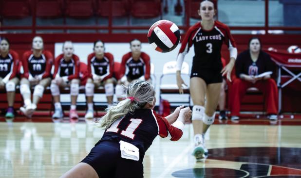 Lady Cub #11 Kynlee Lauderdale dives for the ball with an amazing dig! | Photo by Will Sadler