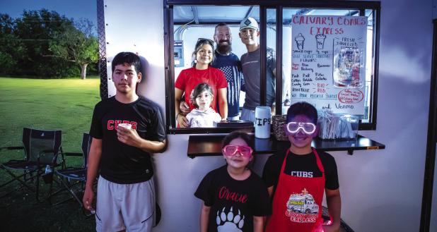 The Behrens family, owner-operators of Calvary Cones Express, served their delicious snow cones from their bus. Photo by Will Sadler