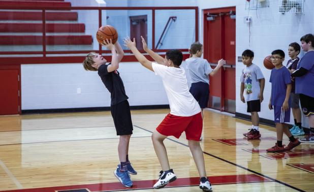 New basketball coach hosts