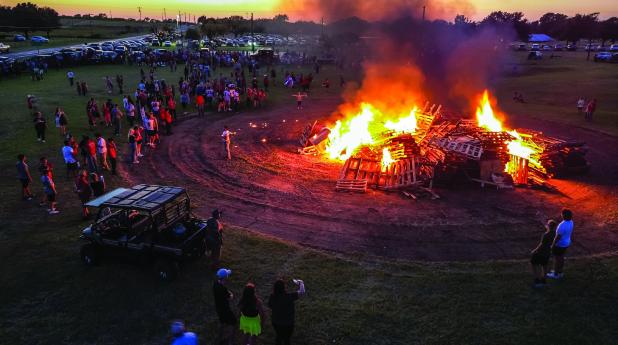 The traditional lighting of a bonfire by OHS seniors gave the Homecoming day’s events a fiery ending. Photo by Will Sadler