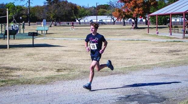 Wesley Symank ran a record time for the Turkey Trot finishing first. Congratulations! Photo by Will Sadler