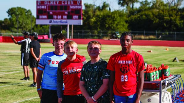 An important position for the Cub football machine is the water boys and managers; that is much more important during the hot days of August. Photo by Will Sadler