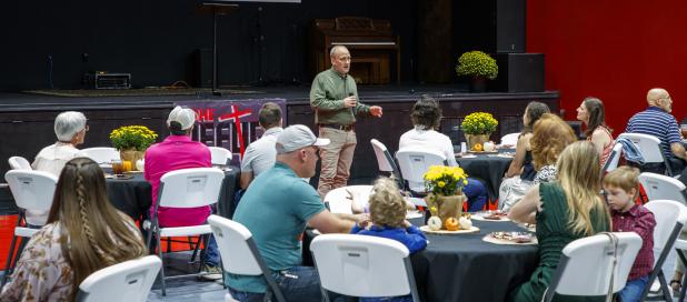 Olney Junior High School Principal and board member Ed Berngen talks about the many contributions The Refuge Christian Community Center has made to the community, churches, and the school district during its 10th anniversary celebration. Photo by Will Sad