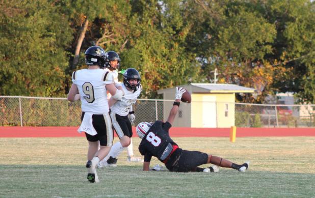 Cubs #8 Eric German holds up the football in the Archer City endzone after catching a touchdown pass from Cubs quarterback Tucker Cortinez during Olney’s Homecoming game against the Wildcats. Photo by Kailyn Altmiller