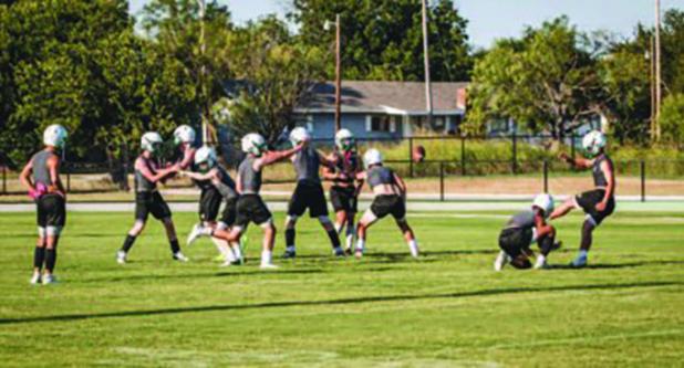 The Bobcats begin practice with special teams working in plenty of kickoffs and extra point kicking. Kicking should be automatic once the ball is hiked and plenty of repetition helps to ensure smooth kicks. Photo by Will Sadler