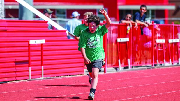 Cotton Gibson sprinting towards the finish line displaying the number three, maybe for third place or third grade, only Cotton will know. Photo by Will Sadler