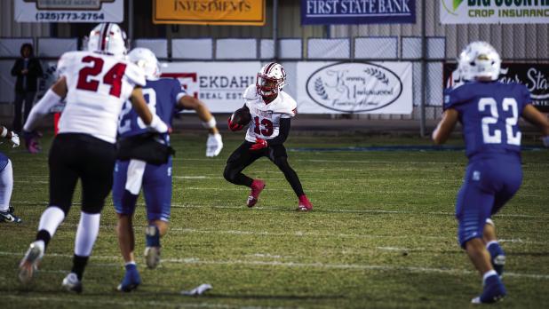 Cub #13 Reggie Williams returns the kickoff during the district game with the Bulldogs. Photo by Will Sadler