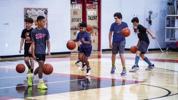 One skill-building game played at the Cub Basketball Camp was the dribble competition. Players had to out-dribble and play a little defense as fellow players could knock the ball away. Photo by Will Sadler