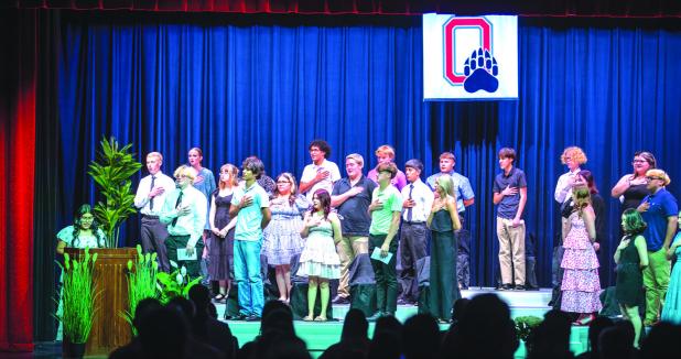 Senior Allison Alvarado leads the Class of 2026 in the Pledge of Allegiance before the state of Senior Awards Night. Photo by Will Sadler