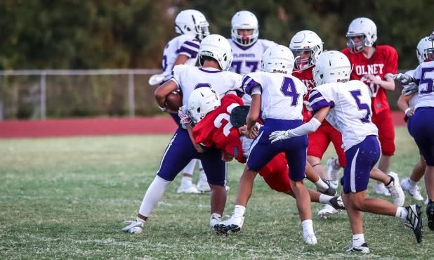 OJH Cub #23 Angel Altuve launches himself at a Plowboy runner for a tackle. Photo by Will Sadler