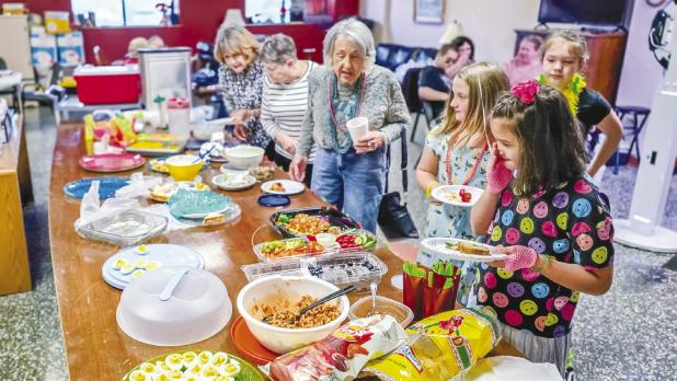 There were plenty of treats and food to keep dancers’ energy up during the Cub Center’s 80s-themed dance party, thanks to a potluck provided by attendees. Photo by Will Sadler