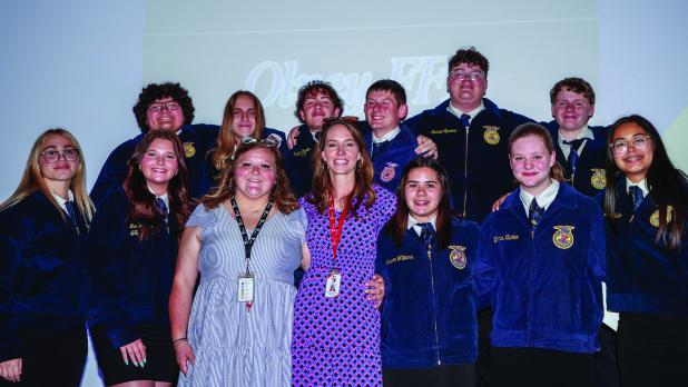 OHS FFA students pose with outgoing FFA teacher Haylee Haralson at the end of the end of year banquet. Photo by Will Sadler
