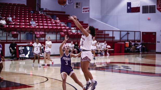 OHS Lady Cub #24 Angel Turner shooting outside the paint against a Lady Buckaroo defender. Turner was a much-needed athlete this season for both volleyball and basketball. She brings confidence and controlled aggression to the boards this season. Photo by