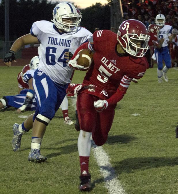 Olney High School senior running back Bradley Garcia carries the ball during his first appearance this season after suffering a thumb injury.