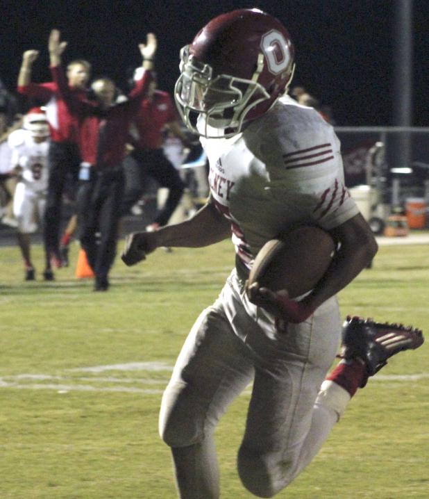 Top: Olney High School senior running back Bradley Garcia reaches the end zone on a 20-yard run, which gave the Cubs a 14-13 lead with 1:11 left in regulation. Chico won 20-14.