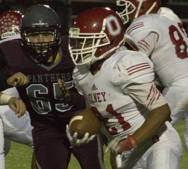 Olney High School freshman Junior Acuna grinds out a few yards during the Cubs' season finale against Seymour.