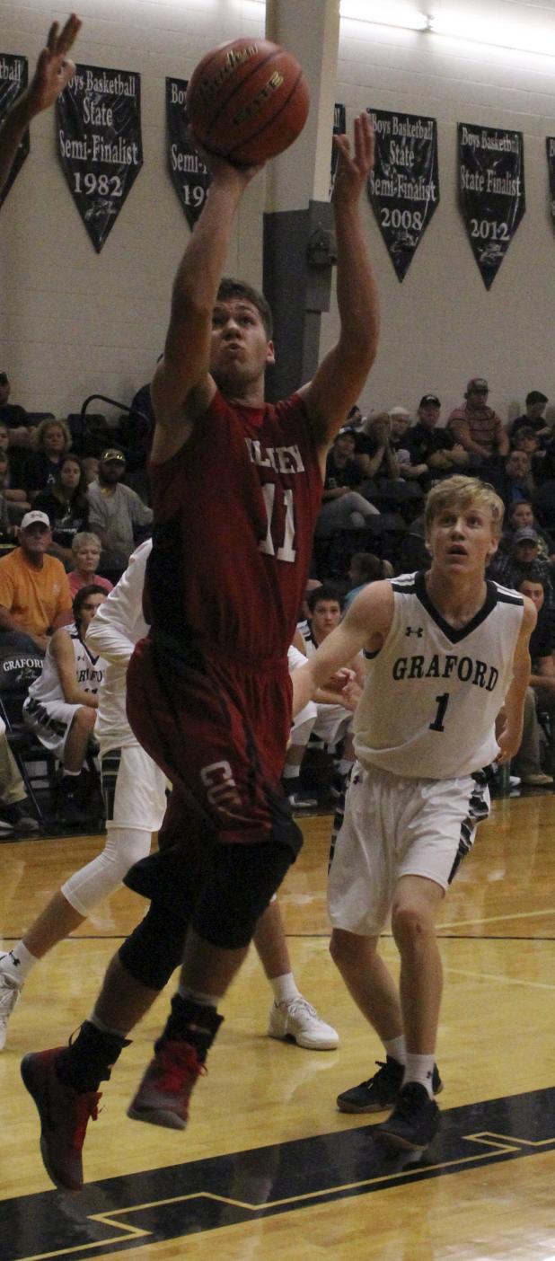 Olney senior forward Eli Johnson goes up for a shot against Graford