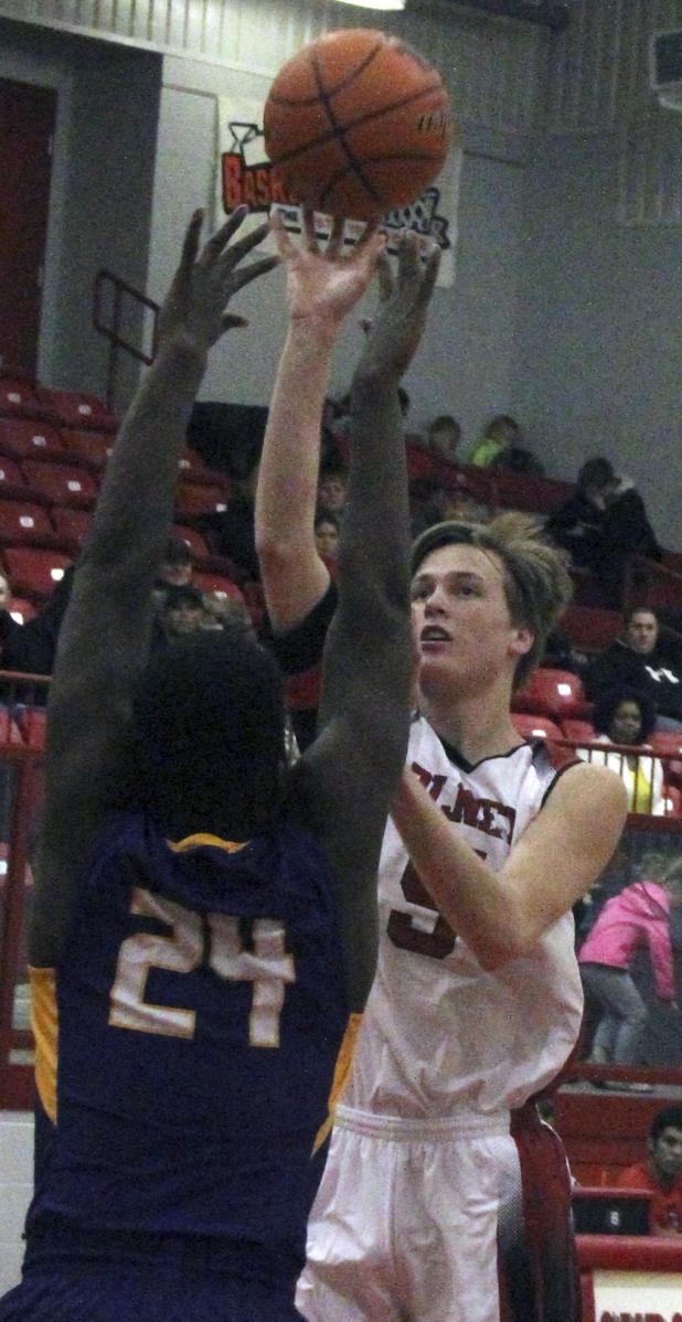 Olney High School senior guard Brent McCorkle sinks a jumper against Munday.