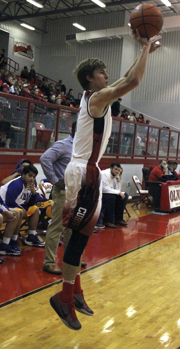 Olney senior guard Carson Fite drains a 3-pointer against Munday.