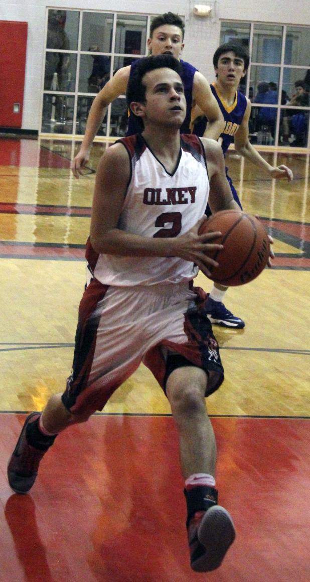 Olney High School senior guard Malik Garza adds to the Cubs' lead against Munday.