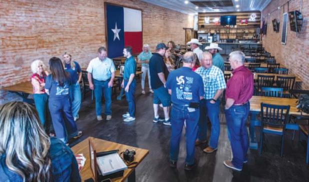 Chamber members mingle ahead of a presentation by child advocacy center Virginia’s House and a luncheon of cajun pasta at Hudson’s on Main. Photo by Will Sadler