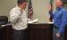 Olney City Attorney Dan Branum swears in Olney’s new city administrator, Andy Wolfe at the June 8 City Council meeting. Mr. Wolfe starts at his new post about nine months after the departure of former city administrator Simon Dwyer. Photo by Dale Lovett