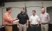 City Attorney Dan Branum (left), swears in newly elected City Councilmembers Colson Ballard, Mayor Rue Rogers, and Sammy Livingston at the May 11 City Council meeting. Photo by Gina Keating