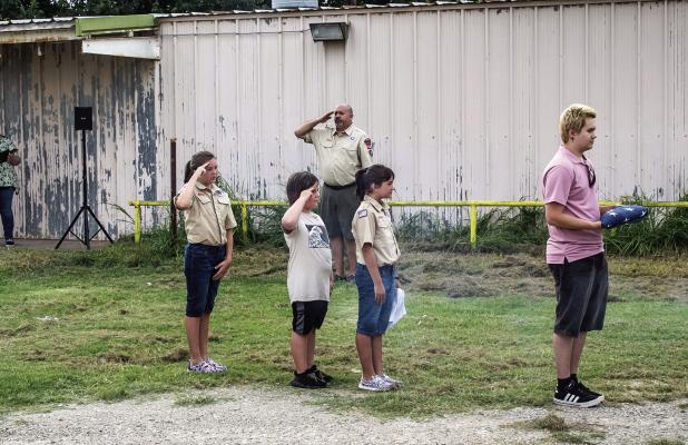 Olney American Legion Post 414 had the help of the Olney Cub Scout Troop 414 for their annual flag retirement ceremony on Sunday, the conclusion of National Flag Week. Participants salute as “To The Color” was played, as the flags were retired to the