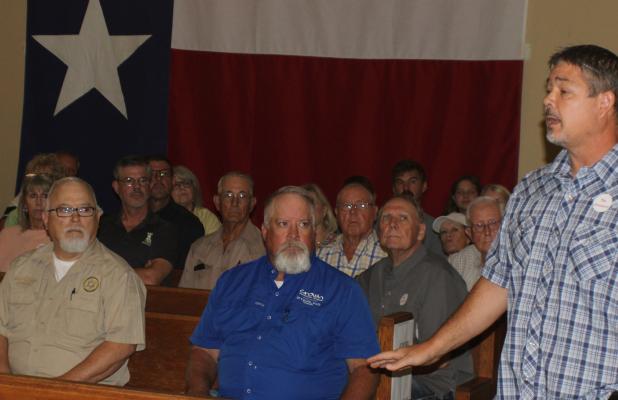 Data center opponent and landowner Ryan Mote addresses the Young County Commissioners ahead of their vote to accept an application from the Project Saltworks data center for a tax abatement. The vote does not mean that the County has granted an abatement.