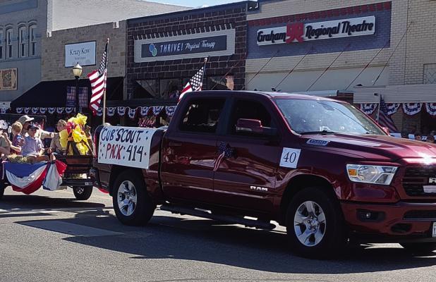 Olney’s Cub Scout Pack 414 led by Chris Garcia was one of several Olney entrants into the Stars and Stripes in Young County parade on the Graham town square on July 4. Olneyites turned out to watch the parade of more than 100 entries and to march in the