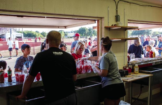 Olney Athletic Booster Club members, OHS coaches, and volunteers are what make special events celebrating OHS Athletes a big success. Meet the Cubs attendees enjoyed free water, watermelon, and hot dogs. Photo by Will Sadler