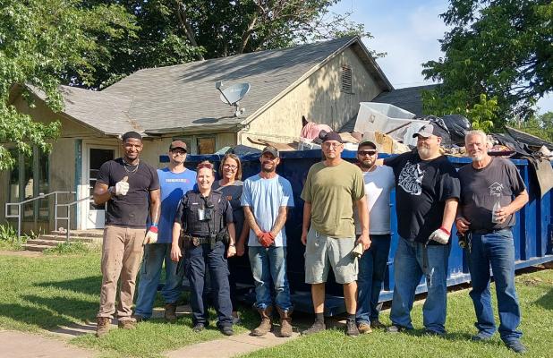 The HOME team: The Olney Police Department and the House of Mercy Enterprises (HOME) teamed up to clean up a house on West Payne as part of a code enforcement push. Photo by Gina Keating