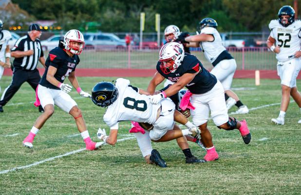 OHS Cub #52 Jacobi Esquivel DLOL brings down an Alvord Bulldog runner. Photo by Will Sadler