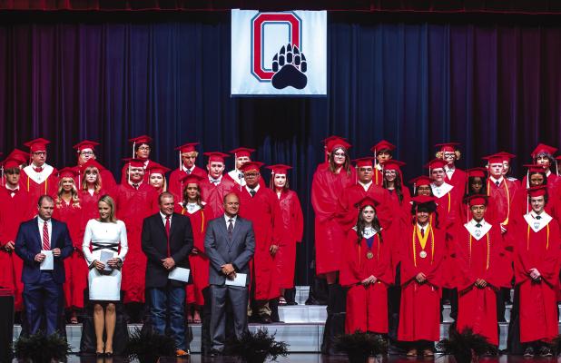 The 42 members of the Olney High School Class of 2026 crossed the stage at the OHS auditorium on Friday, May 15 to claim their diplomas after a week of traditions marking the event. The class is joined by (at left) OHS Principal Haylee Haralson, OISD Supe
