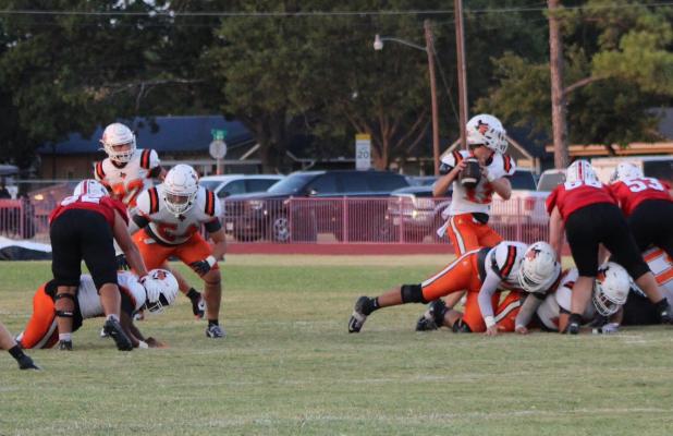 Petrolia Quarterback Cody Cox led the Pirates to a 30-26 victory over the Cubs in Olney Stadium, coming from behind with a grinding running game. Photo by Gina Keating