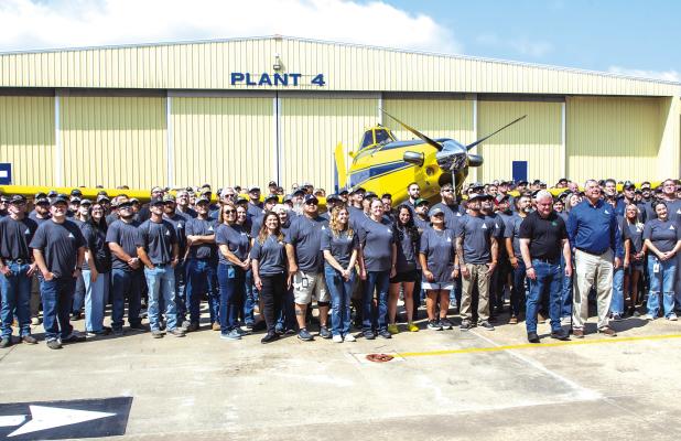Air Tractor employees and management mark the delivery of the company’s 5,000th aircraft to Brazilian aerial application operator Dorilino Prediger, whose representatives came to Olney on May 28 to take possession of the ag plane. The company held a cel