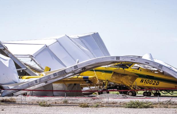 A powerful thunderstorm swept into town on Sunday, July 5, causing damage across Olney and twisting Air Tractor’s temporary hangar on top of 16 aircraft. Photo by Will Sadler