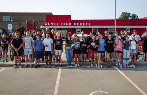 OHS Seniors pose for a photo before painting the street in front of the high school. Left to right: Cheyanne Burger, Makayla Strawbridge, Blaize DeVries, Kaydence Tackett, Case Gray, Ariel Herrera, Benjamin Baran, Ryder Lisle, Alyvia Vega, Josh Hart, Bray
