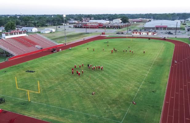 Cub football players began the year’s first practice on the Cub Stadium field, running a few routes before heading to the updated Cub practice field. Photo by Will Sadler