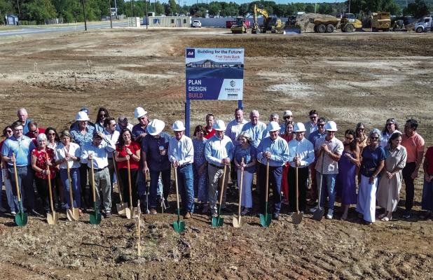 First State Bank employees and board members gathered at the construction site in Graham to celebrate the groundbreaking on a new, 14,000-squarefoot bank building at 1501 Fourth Street. The new buildilng will provide more room as the locally focused bank 