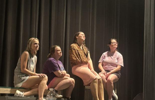 Summer Branum, Stormie Harris, Karyna Balch, and Catherine Smith run their lines during a recent rehearsal for the Graham Regional Theatre’s production of “Little Shop of Horrors,” opening Friday and running through Sunday. Photo courtesy of GRT