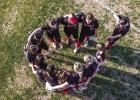OHS Lady Cubs circle up for a last minute pow wow before taking on Knox City for their first game in the OISD Tourney. Photo by Will Sadler