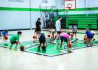 Coach Lane Dollar and Mattie Dollar run camp attendees through skill drills. Photo by Will Sadler