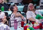 Edwana Fikes, a longtime volunteer at the Olney Senior Cub Center, reacts to thanks by Center director Angela Lockard. Photo by Will Sadler