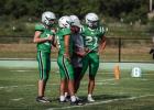 Veteran Head Football Coach Isiah Archer leads the way for another successful season for the Bobcats, shown going over a play with Bobcats during a scrimmage with St. Jo. Photo by Will Sadler