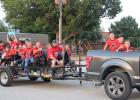 Olney Elementary School’s Top of Texas football team cheers and throws candy along the parade route, riding to Cub Stadium for a pep rally for Olney’s Homecoming game against Archer City on Sept. 16. Photo by Kailyn Altmiller