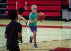 A Cub practices his passing skills during camp. Photo by Will Sadler
