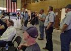 County Commissioners Jimmy Wiley and Scott Shook (standing on right) and Alan Craig and Stacy Creswell (sitting on left) listen as Young County residents question solar farm reps at the Eliasville-South Bend Volunteer Fire Department on Nov. 5. The projec