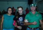 Sophie is escorted by parents Erin and Quentinn Terrell during Senior Night. Photo by Will Sadler